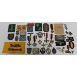 A COLLECTION OF GERMAN BADGES, MEDALS, BUCKLES ETC., to include Iron Cross 1st & 2nd class, War Mer