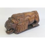 AN UNUSUAL CARVED FIGURE OF A MYSTIC BEAST, signed Nevis 2002. L. 48 cm