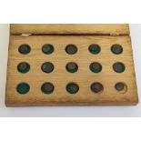 FOURTEEN ANCIENT BRONZE COINS, mainly minor Greek & Roman, in a home-made fitted wooden box