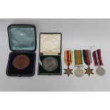 A CASED BRONZE 1897 JUBILEE MEDAL, 1911 Coronation medal and four WWII service medals (unnamed as i
