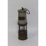 A MINER'S LAMP marked 'J. H. Naylor, Wigan'