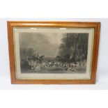 A FRAMED AND GLAZED ENGRAVING DEPICTING A HUNTING SCENE TITLED 'THE MEET AT BLAGDON' ENGRAVED BY TH