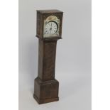A TREEN POCKET WATCH HOLDER, in the form of a longcase clock, currently fitted with a pocket watch