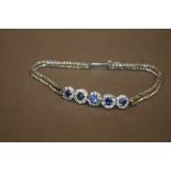 A LADIES GEMSET WHITE METAL BRACELET