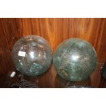 A PAIR OF LARGE DECORATIVE GLASS BALLS