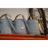 TWO GALVANIZED WATERING CANS