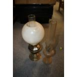 A VINTAGE OIL LAMP WITH DUPLEX BURNER, PLUS ANOTHER