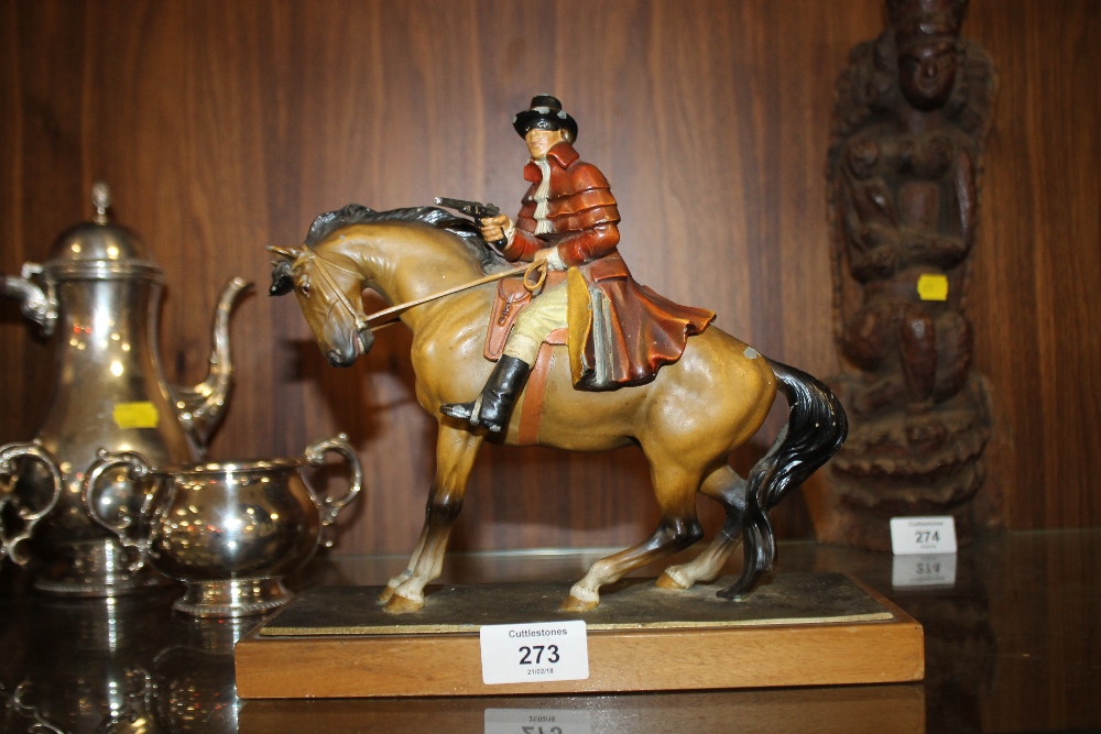 A COLD PAINTED METAL ART DECO TABLE LIGHTER OF A MAN ON HORSEBACK