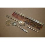 A STERLING SILVER GOLF TEE, COMB AND TEA SPOON