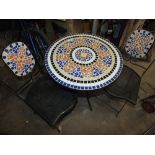 A MOSAIC STYLE GARDEN TABLE WITH MATCHING SEATS (3)