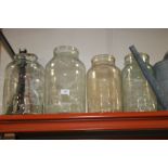 FOUR LARGE RECYCLED GLASS JARS