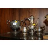 A THREE PIECE SILVER PLATED TEA SERVICE TOGETHER WITH A TWIN HANDLED CUP (4)