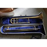 A CASED VINTAGE BRASS BOOSEY AND HAWKES REGENT TROMBONE