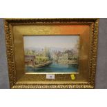 AN UNSIGNED GILT FRAMED AND GLAZED WATERCOLOUR OF A CANAL SCENE