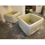 A PAIR OF SQUARE STONE PLANTERS WITH ROSE DECAL