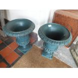 A SMALL PAIR OF GREEN GARDEN URNS