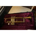 A CASED BRASS BOOSEY AND HAWKES 400 TRUMPET
