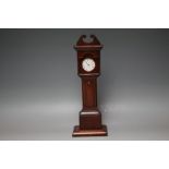 A LATE 19TH CENTURY FOLK ART CARVED WOODEN POCKET WATCH STAND IN THE FORM OF A LONGCASE CLOCK, H
