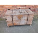 AN ANTIQUE STYLE BLANKET BOX WITH METAL BANDING, having small hinged access door to top, raised on