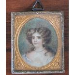 A LATE 19TH / EARLY 20TH CENTURY OVAL MINIATURE PORTRAIT STUDY OF A YOUNG WOMAN, unsigned,