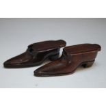 TWO GEORGIAN STYLE MAHOGANY SNUFF HOLDERS CARVED IN THE FORM OF SHOES, longest 8.5 cm