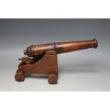 AN EARLY 20TH CENTURY LIBRARY MODEL OF A CANNON MADE FROM THE DECKING OF 'THE MAURITANIA', having