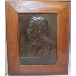 AN ARTS AND CRAFTS COPPER PORTRAIT PANEL OF A GENTLEMAN, the image in relief form, panel below