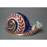 A ROYAL CROWN DERBY PAPERWEIGHT IN THE FORM OF A SNAIL, printed marks to base, no stopper, W 13 cm
