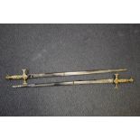 A PAIR OF KNIGHTS TEMPLAR CEREMONIAL SWORDS, with leather scabbards (both scabbards damaged),