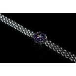 A AMETHYST AND DIAMOND SILVER BRACELET, coming with a certificate that states the cushion cut