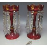 A PAIR OF BOHEMIAN RUBY AND GILT GLASS LUSTRES, having scalloped shaped rims and fluted stems, H