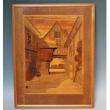 A 20TH CENTURY ARTS & CRAFTS STYLE INLAID SPECIMEN WOOD PANEL, depicting a Tudor style coaching inn,