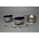 A HALLMARKED SILVER PIERCED CRUET SET - BIRMINGHAM 1897/99, together with three assorted