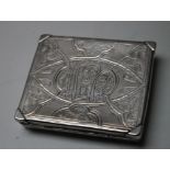 A LATE 19TH / EARLY 20TH CENTURY PERSIAN WHITE METAL CIGARETTE BOX, the lid with typical Islamic