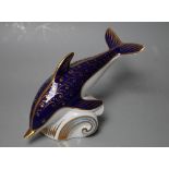 A ROYAL CROWN DERBY PAPERWEIGHT IN THE FORM OF A DOLPHIN, printed marks to base, gold stopper, W