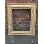 A LATE 19TH CENTURY GILTWOOD STEPPED PICTURE FRAME, with carved detail, rebate 51 x 41 cm