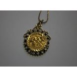A QEII HALF SOVERIGN IN PENDANT MOUNT DATED 1982, in a gem set mount on a 9ct gold chain, approx