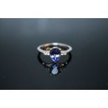 A HALLMARKED 14K WHITE GOLD PEAR SHAPED AAA TANZANITE AND DIAMOND RING, coming with certificate