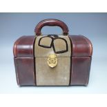 A VINTAGE LEATHER AND VELOUR EQUESTRIAN THEMED VANITY CASE, having crossed stirrups logo to the