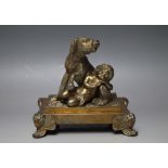 A LATE 19TH / EARLY 20TH CENTURY GILT BRONZE FIGURE OF A CHERUB LIKE CHILD WITH DOG, raised on a