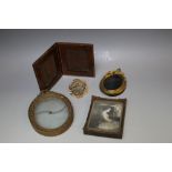 FOUR VARIOUS MINIATURE FRAMES, to include a mourning brooch spinner together with a leather bound