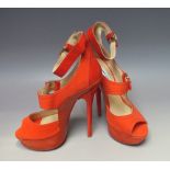 JIMMY CHOO - A PAIR OF 'LETITIA' CORAL AND ORANGE NUBUCK PLATFORM SANDALS, size 39 ½