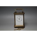 A BRASS CASED 'MATTHEW NORMAN OF LONDON' REPEATER CARRIAGE CLOCK, enamel face with Roman numerals,
