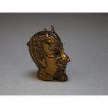 A GILT BRASS NOVELTY VESTA CASE IN THE FORM OF A DEVIL'S HEAD, with inset red glass eyes, L 5 cm