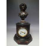 AN ART NOUVEAU BRONZE FIGURAL AND ROUGE MARBLE CLOCK, the bronze figural bust surmount a reeded