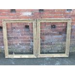 A PAIR OF ANTIQUE GILTWOOD PICTURE FRAMES, each with carved and moulded decoration, rebate 58 x 74