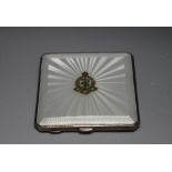 A HALLMARKED SILVER AND GUILLOCHE ENAMEL COMPACT FOR THE ROYAL ARMY MEDICAL CORPS BY DEAKIN &