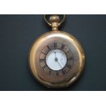 A ROLLED GOLD HALF HUNTER POCKET WATCH, the white dial with Roman numerals and outer minute ring,