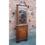 A MAHOGANY INLAID GLAZED CORNER CABINET, in the Dutch marquetry style with satinwood inlaid