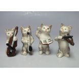 A SET OF FOUR BESWICK CAT MUSICIANS, comprising a conductor, cellist, violinist and saxophonist (4)